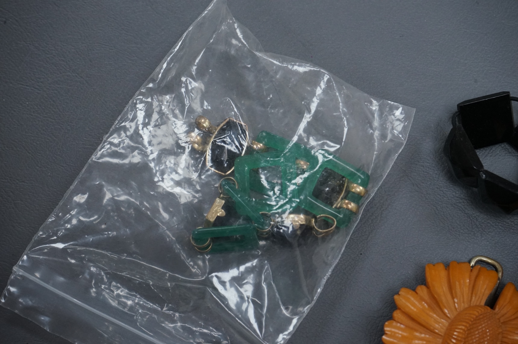 A collection of late 19th and 20th century buttons, some novelty, made from varying materials, metal, bakelite and glass.